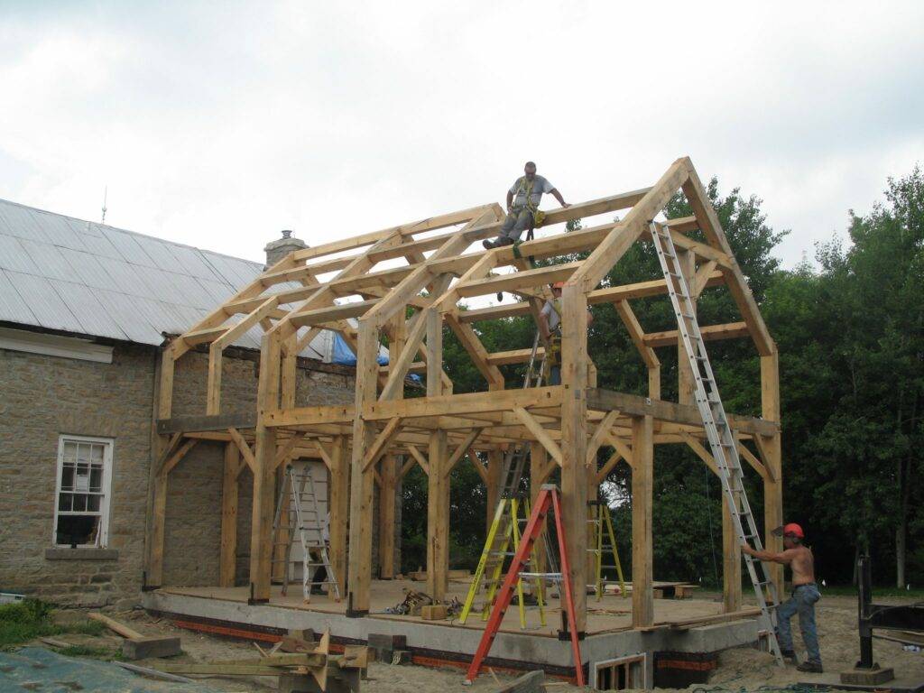 One of the many timber frames Ray Gibbs has built. Though he works alone in his shop, he has a crew to help raise the frames.