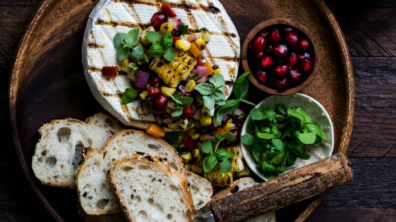 The Food Gays’ Campfire Brie with Grilled Corn Salsa